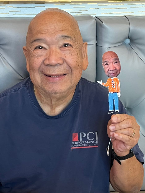 A senior care participant with their puppet self.